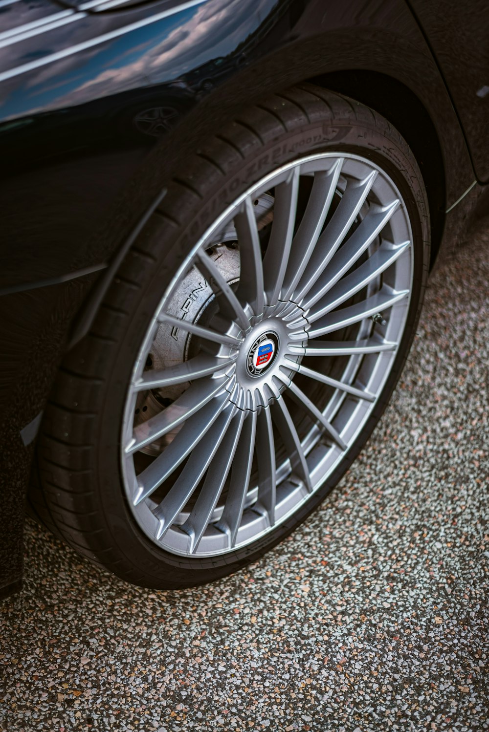 a close up of a car tire on the ground