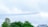 A stunning view of several RC aircraft flying in formation above a scenic landscape.