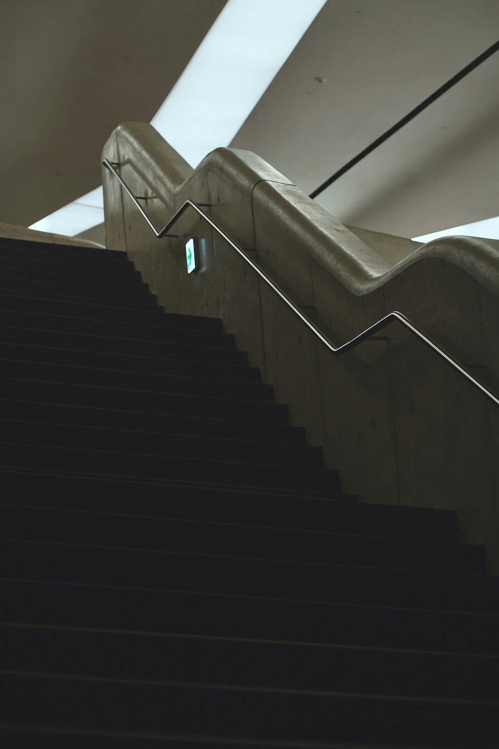a set of stairs leading up to a skylight