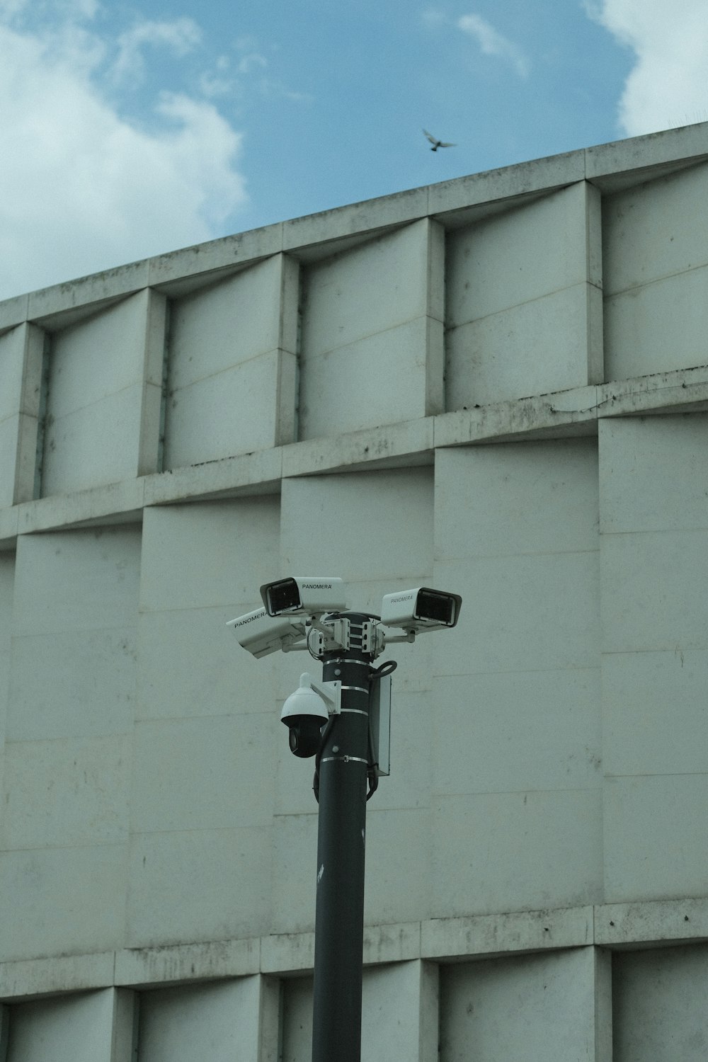 a street light with a building in the background