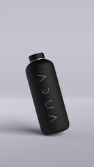 A sleek matte black bottle with minimalistic design, featuring the word 'AQUA' written vertically. The bottle is slightly tilted against a muted gray background.