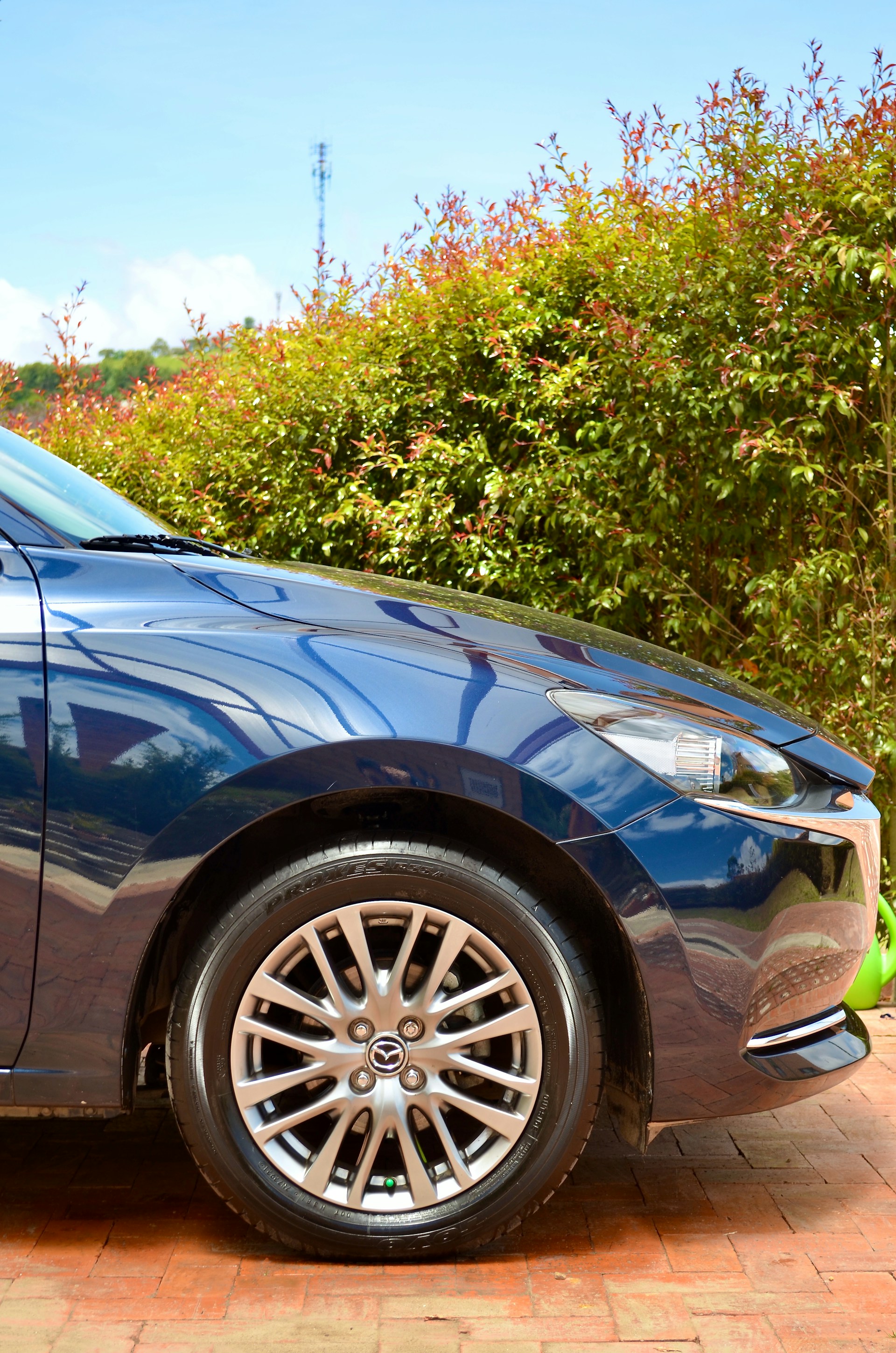 woman wearing yellow long-sleeved dress under white clouds and blue sky during daytime