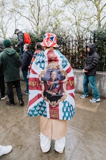 a man wearing a british flag jacket and hat