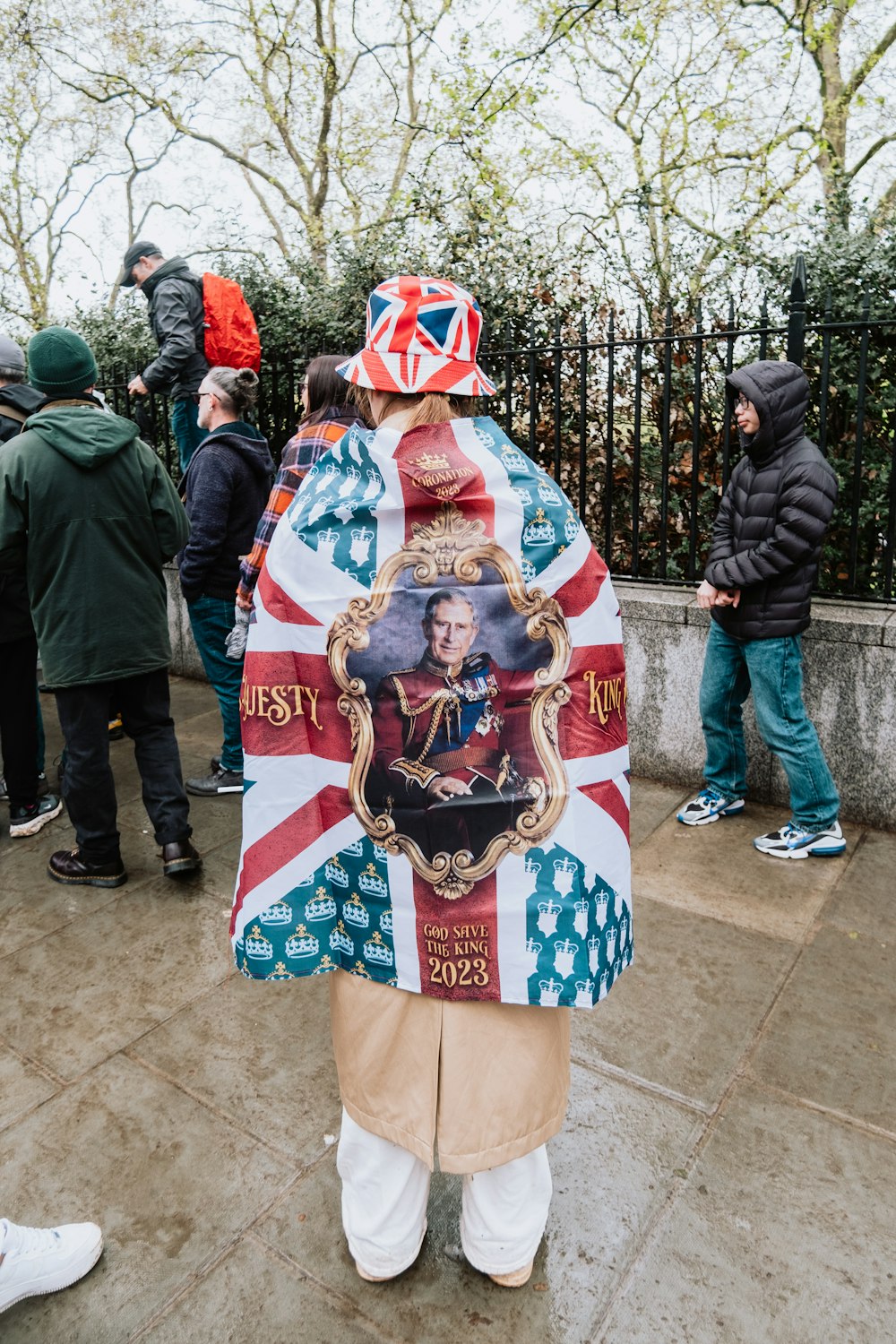 a man wearing a british flag jacket and hat