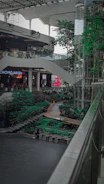 Shopping mall atrium enhanced by large-scale artificial greenery installations