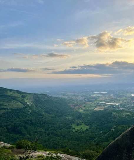 Sunset view over the lush green hills surrounding Aamby Valley Lonavala.