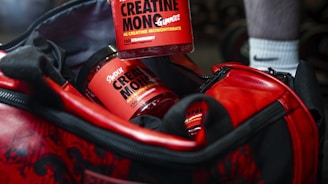 a man is holding a cup of coffee in a duffel bag