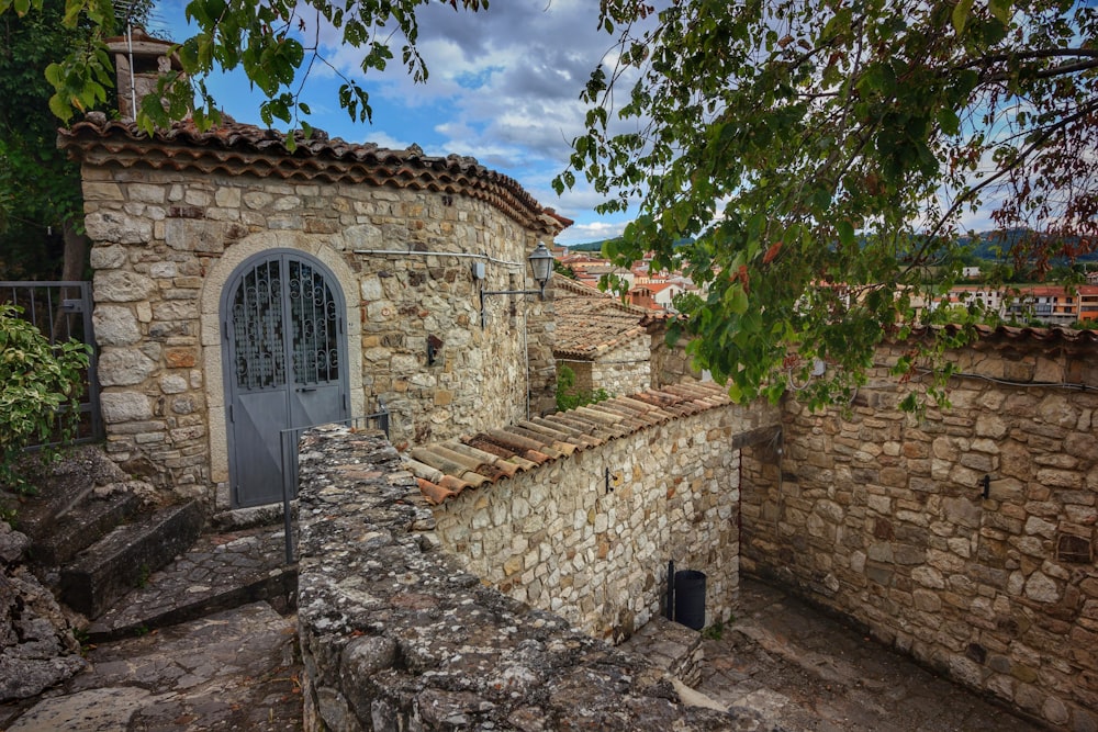 a stone building with a door and a window