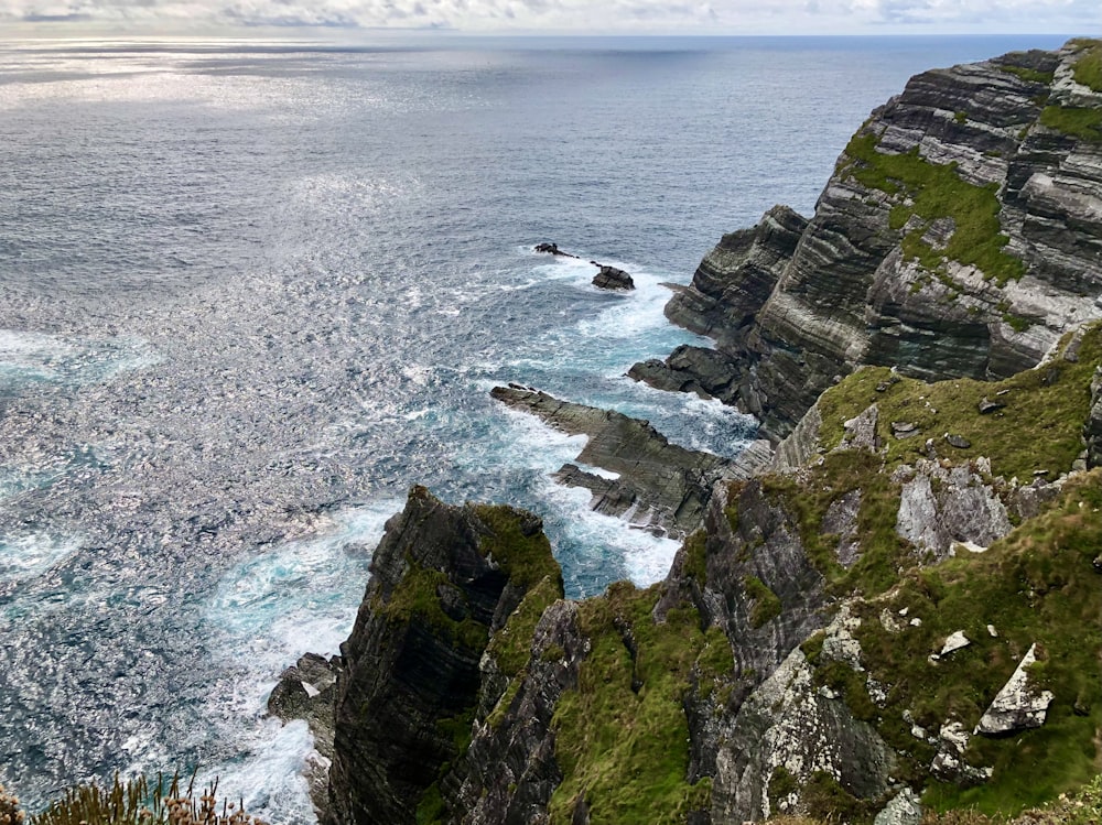 a view of the ocean from the top of a cliff