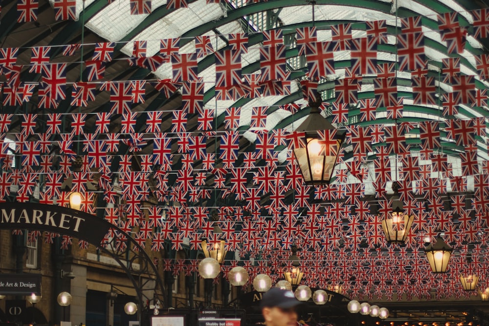 a building with a lot of flags hanging from it's ceiling