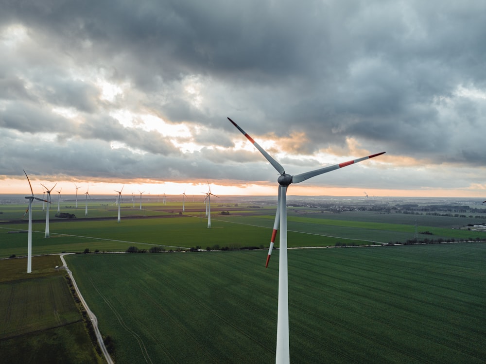 a wind farm with several windmills in the distance