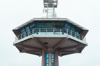 a tall tower with a clock on the top of it