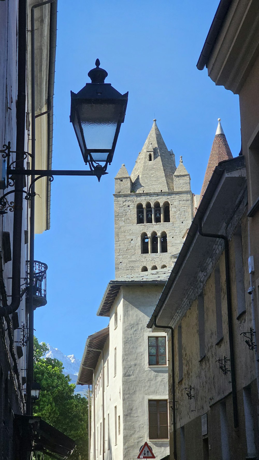 a street light hanging from the side of a building