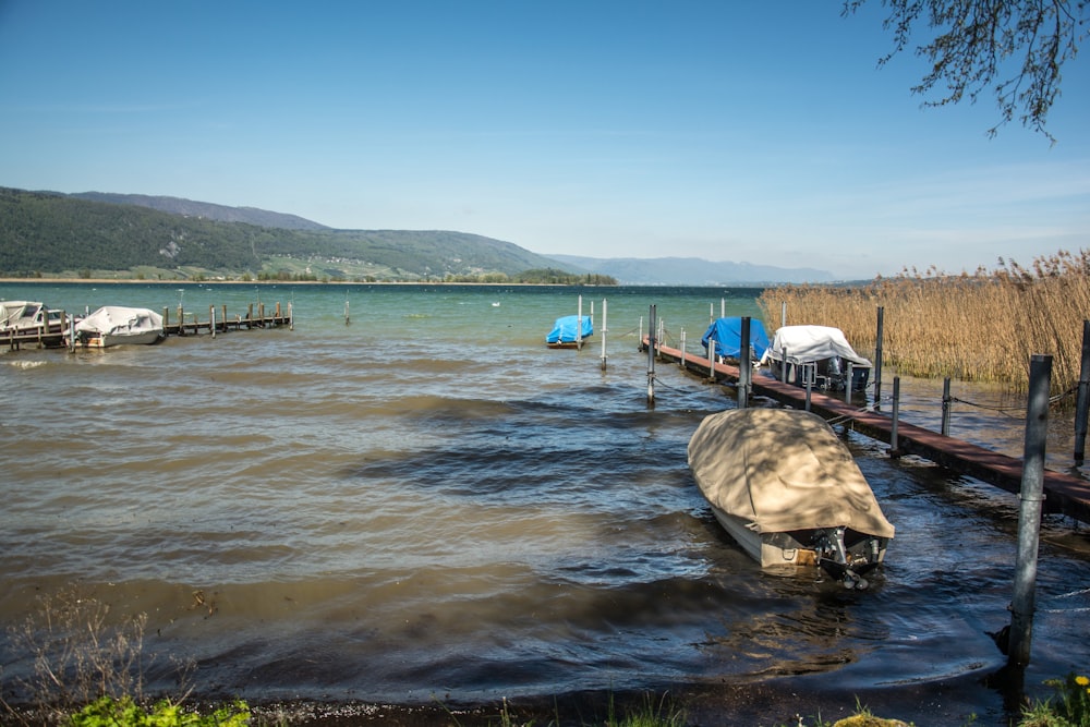 a boat is docked at the end of a pier