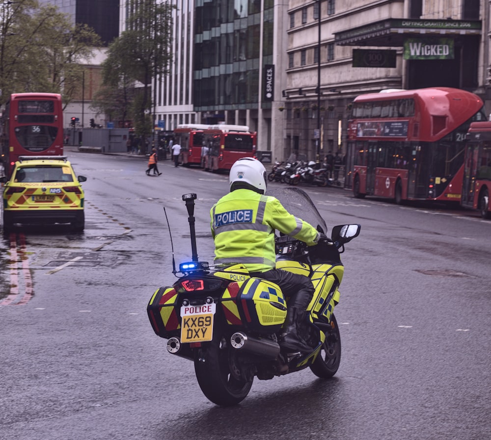 a police officer riding a motorcycle on a city street