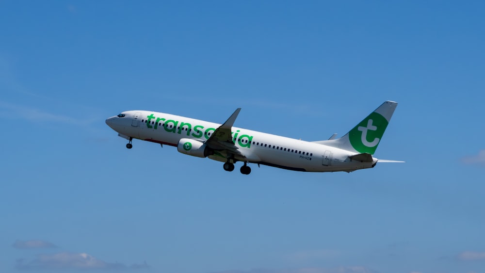 a large passenger jet flying through a blue sky