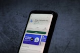 A smartphone screen displays the Google Play Store page for the application 'Bing: Chat with AI & GPT-4' by Microsoft Corporation. The app has an install button, a rating of 4.4 stars, and over 10 million downloads. The background is a textured dark surface.