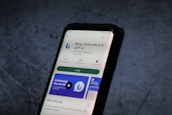 A smartphone screen displays the Google Play Store page for the application 'Bing: Chat with AI & GPT-4' by Microsoft Corporation. The app has an install button, a rating of 4.4 stars, and over 10 million downloads. The background is a textured dark surface.