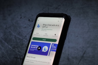 A smartphone screen displays the Google Play Store page for the application 'Bing: Chat with AI & GPT-4' by Microsoft Corporation. The app has an install button, a rating of 4.4 stars, and over 10 million downloads. The background is a textured dark surface.