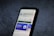 A smartphone screen displays the Google Play Store page for the application 'Bing: Chat with AI & GPT-4' by Microsoft Corporation. The app has an install button, a rating of 4.4 stars, and over 10 million downloads. The background is a textured dark surface.