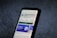 A smartphone screen displays the Google Play Store page for the application 'Bing: Chat with AI & GPT-4' by Microsoft Corporation. The app has an install button, a rating of 4.4 stars, and over 10 million downloads. The background is a textured dark surface.