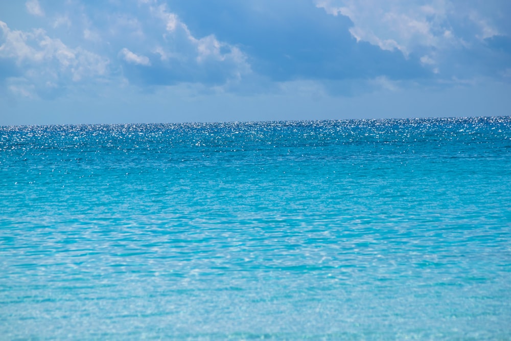 a large body of water with a sky background