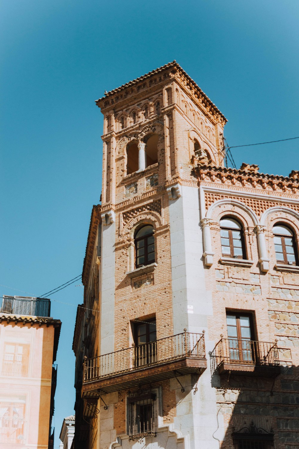 a tall building with a clock on the top of it