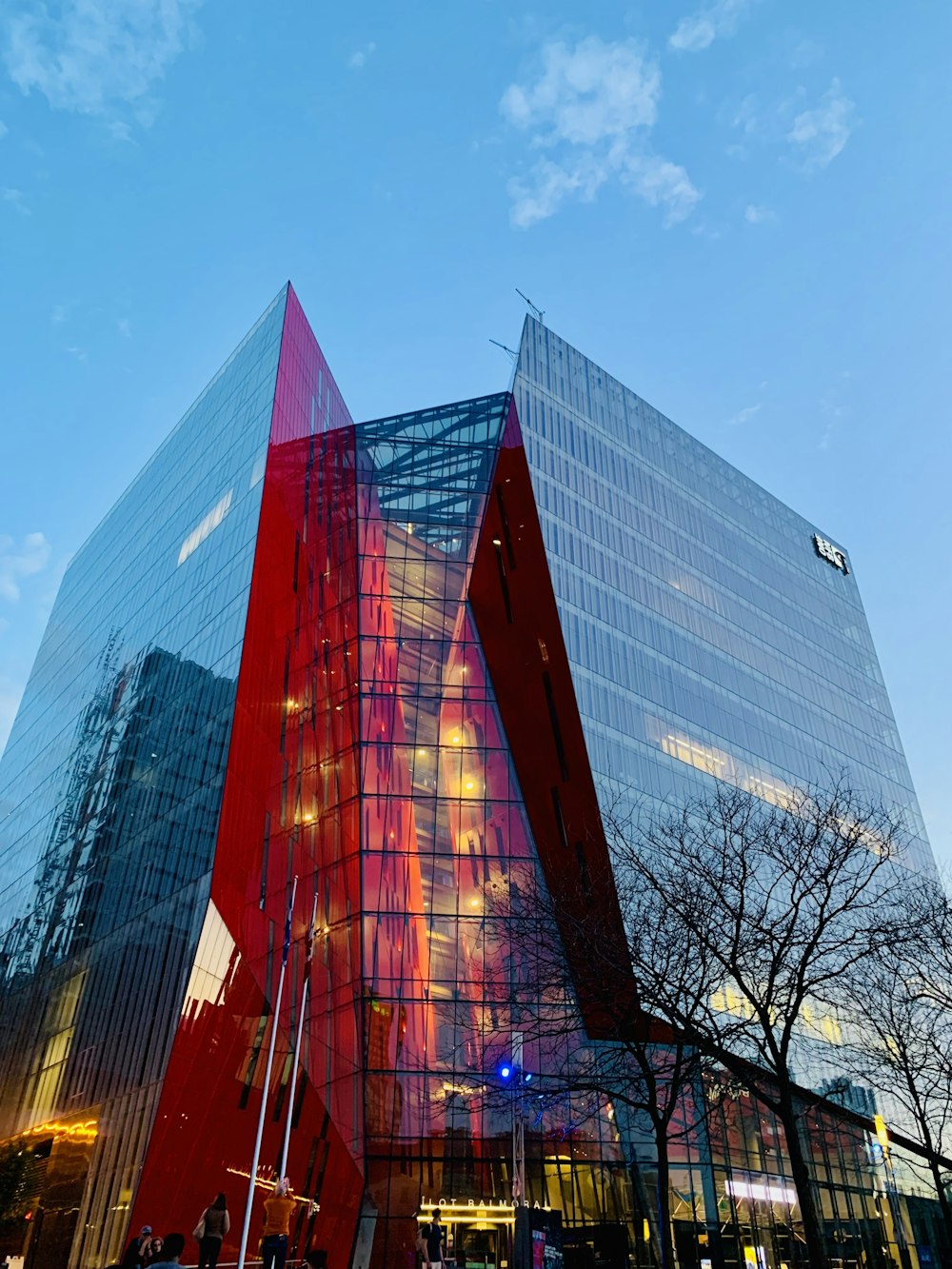 a tall building with a red triangle on the front of it