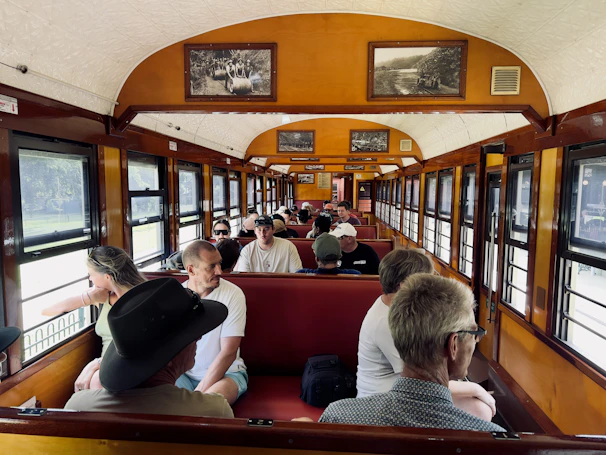 A family enjoying snacks and laughter in the train’s dining car, creating lasting memories.