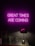 A neon sign with the words 'GREAT TIMES ARE COMING' in bright pink hangs on a dark wall. Below it, a sleek black desk lamp sits on a reflective surface, alongside a small green plant and a geometric glass ornament.