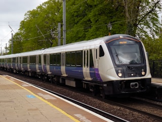 a train on a train track near a platform