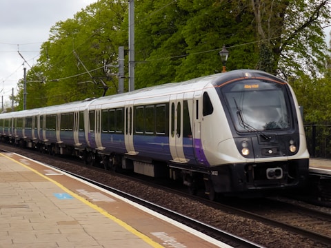 a train on a train track near a platform