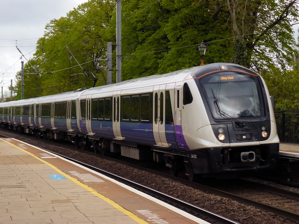 a train on a train track near a platform