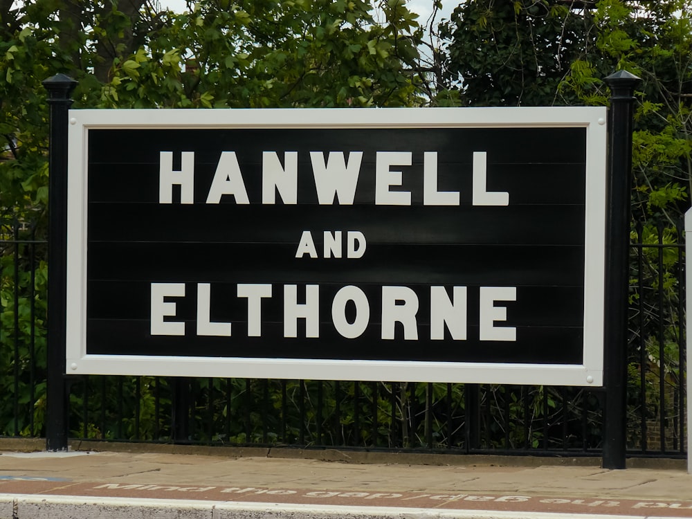 a black and white sign that says hanwell and ellthhorne