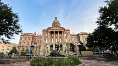 a large building with a statue in front of it