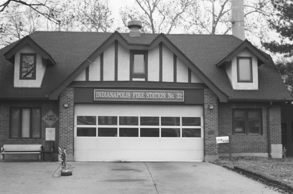 a black and white photo of a fire station