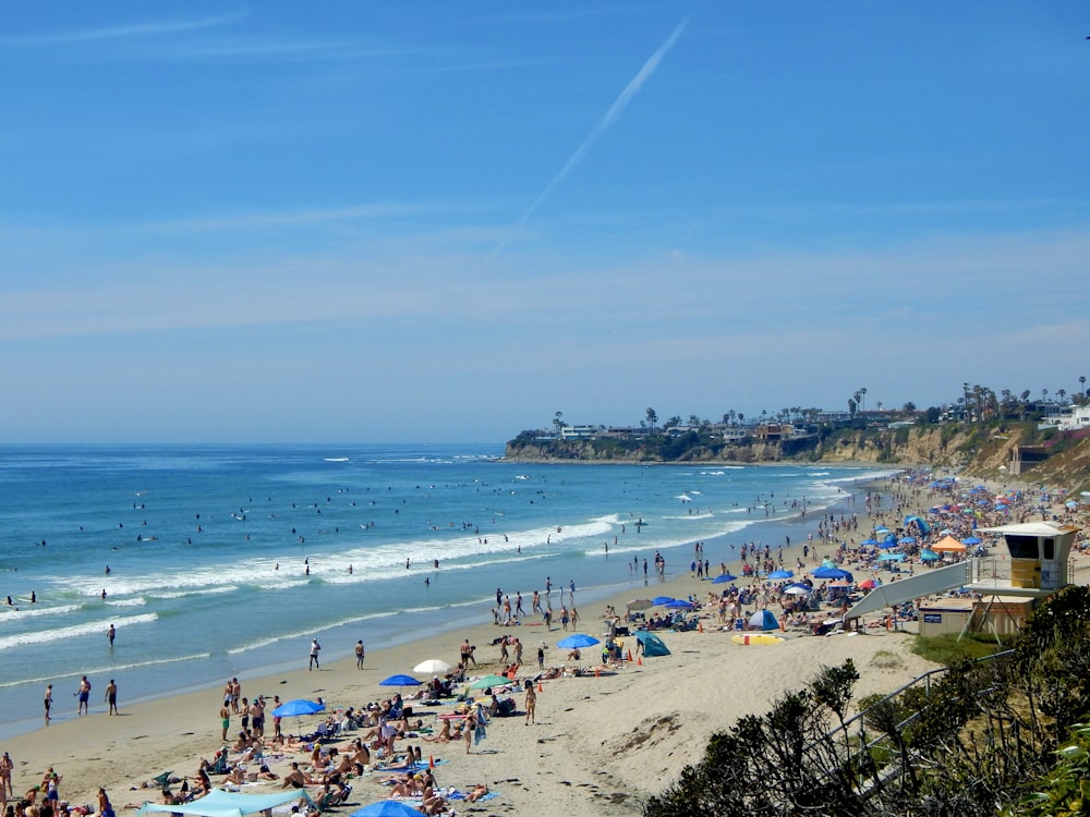 a crowded beach filled with lots of people