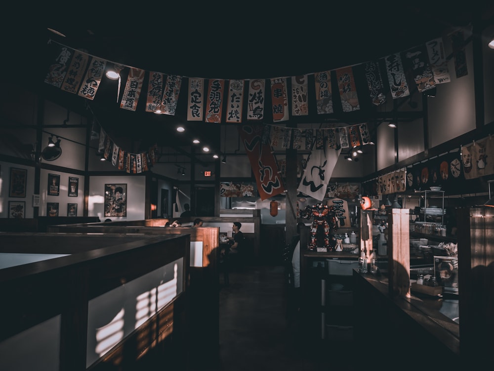 a restaurant with a lot of pictures hanging from the ceiling