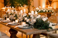 An inviting dining setup with soft lighting and elegant tableware ready for guests.