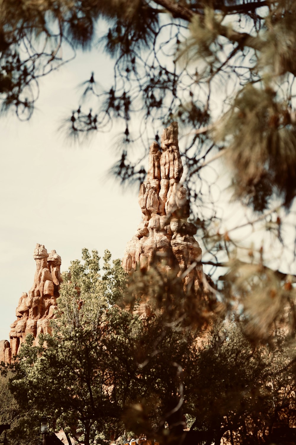 a view of the top of a building through the trees