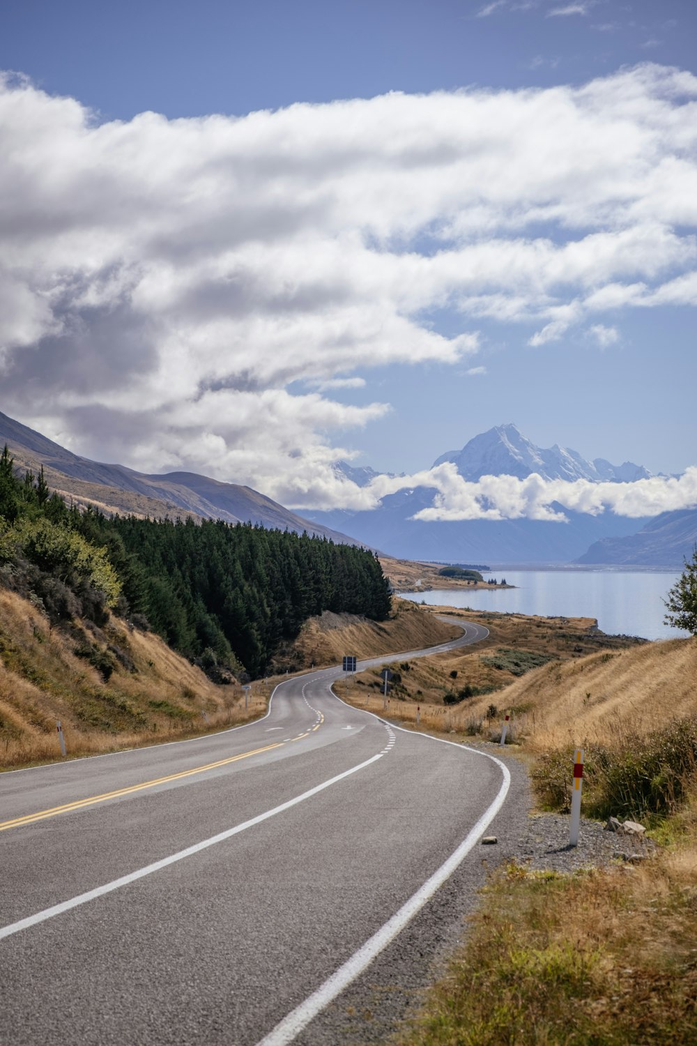 a road with a mountain in the background