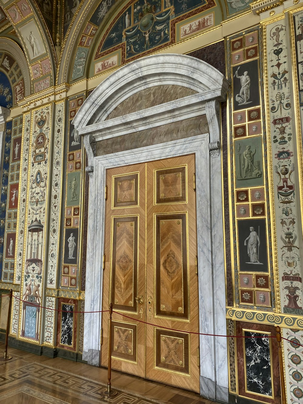 a large wooden door in a very ornate building