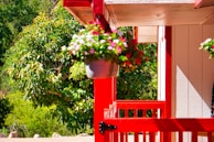 A before-and-after shot showing a freshly painted porch with vibrant colors.