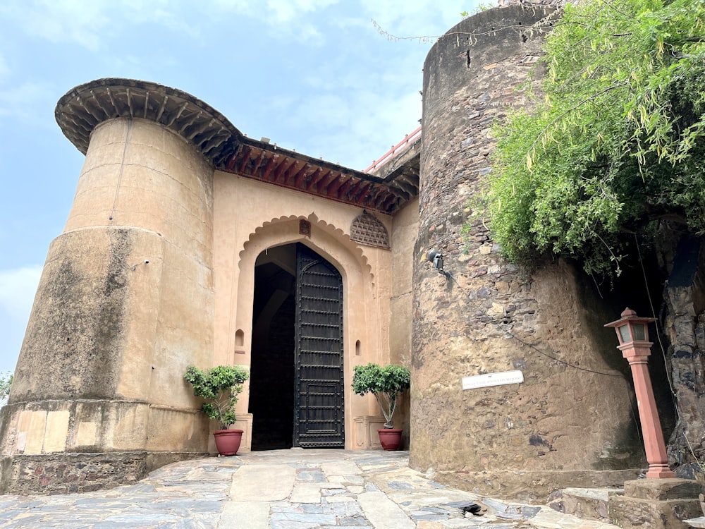 a very old building with a big black door