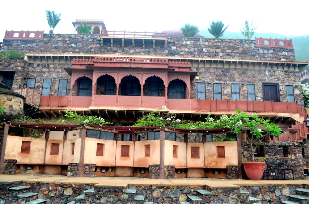 an old building with a lot of windows and shutters