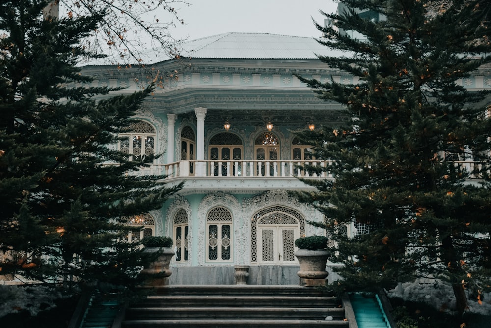 a large white building with stairs leading up to it