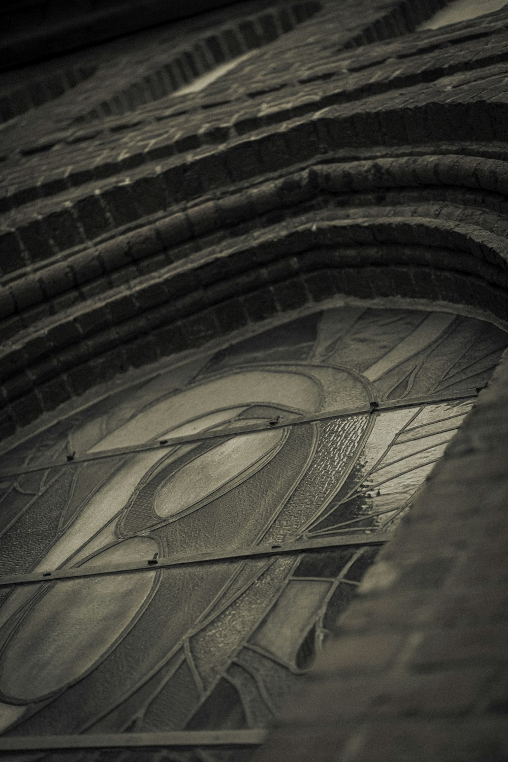 a close up of a clock on a brick building