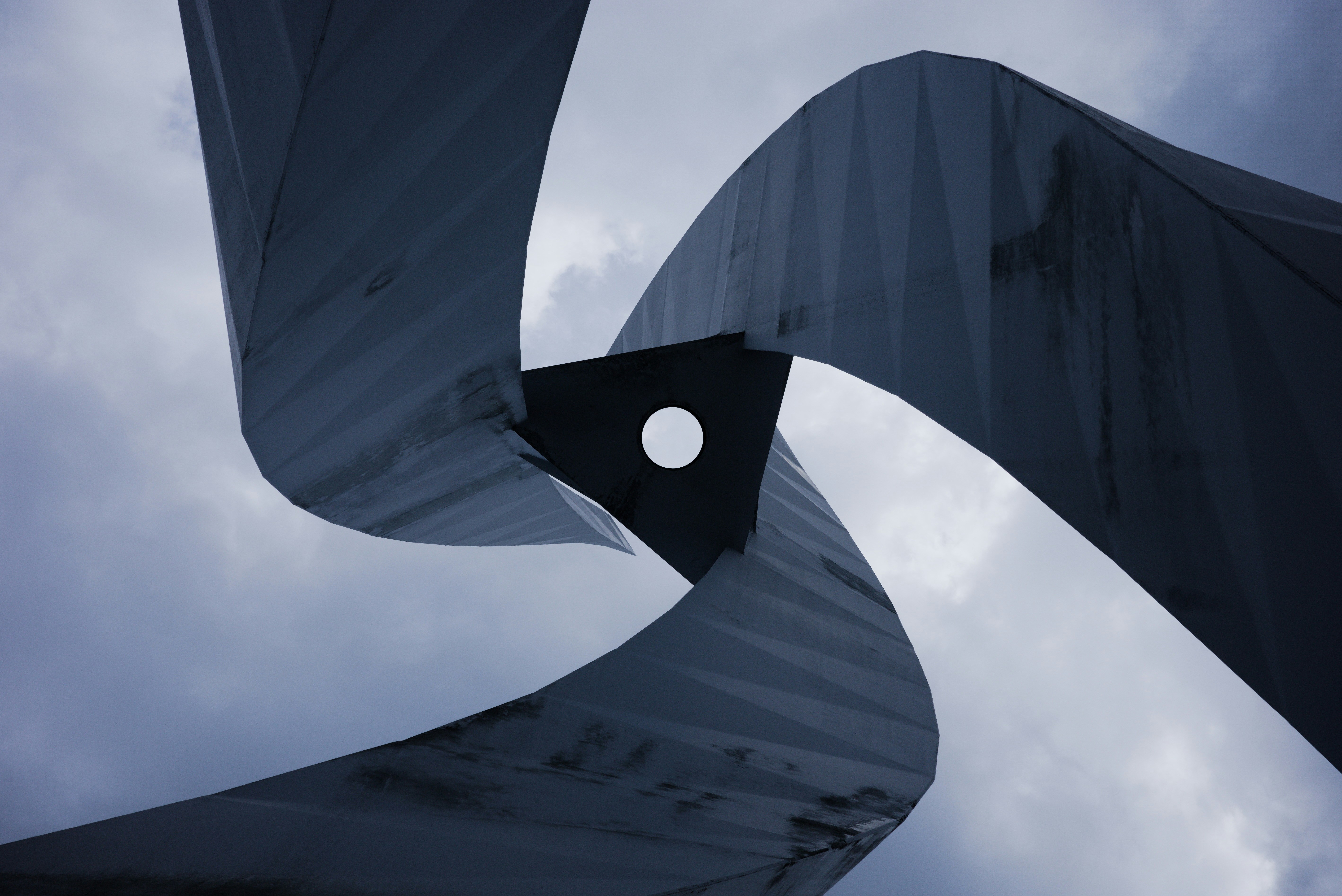 a sculpture with a hole in the middle of it