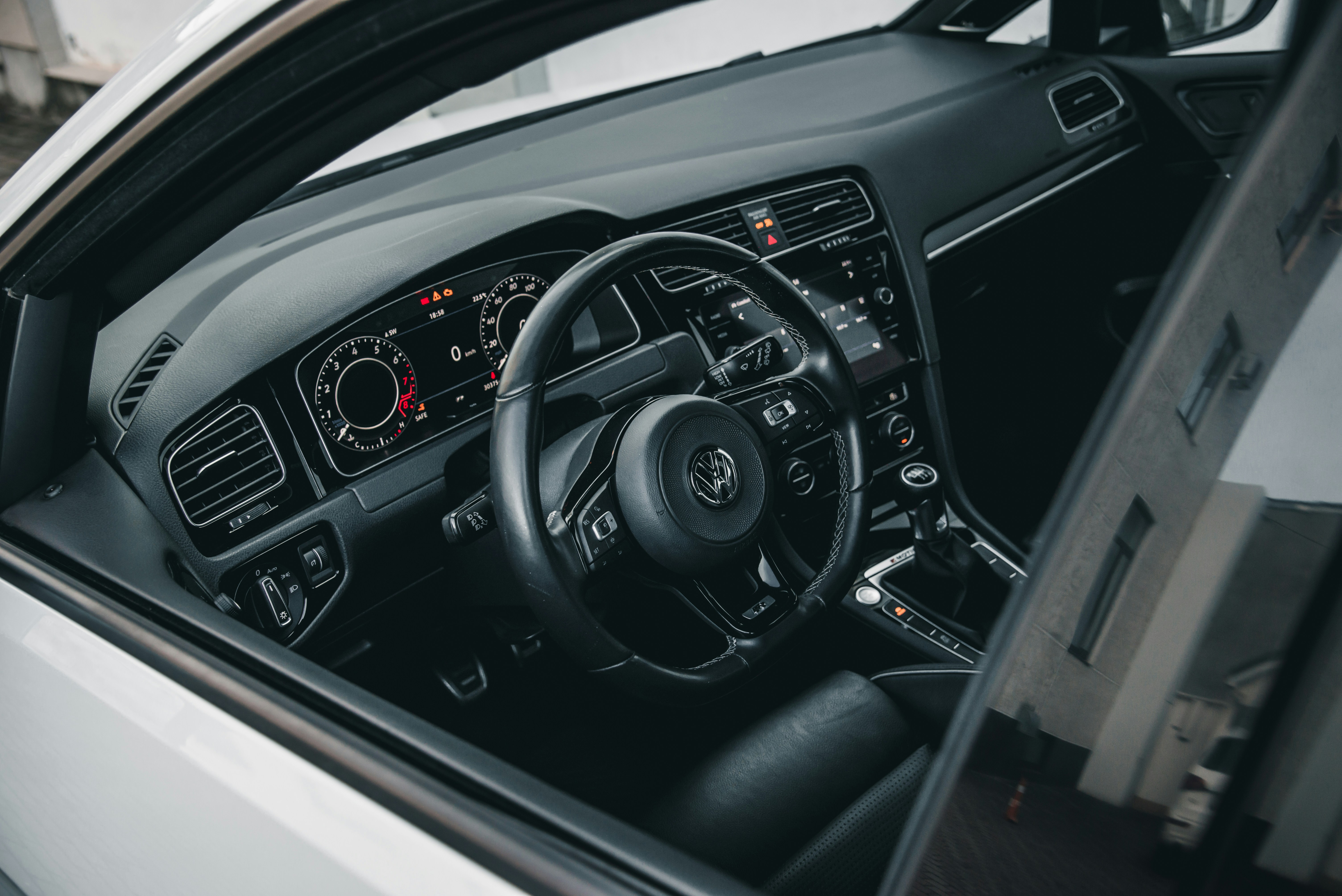 Leather-wrapped steering wheel designed for Volkswagen Beetle models.