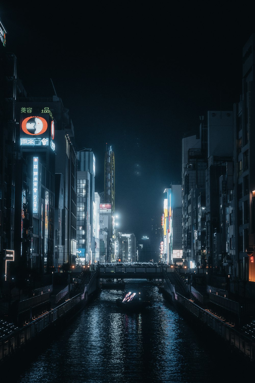 a river running through a city at night